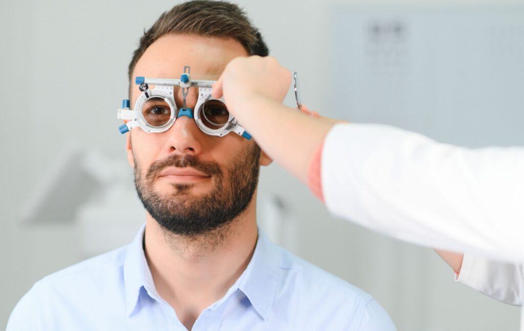 An optometrist uses an optical trial lens to test their patient's prescription and determine if they will need a plano lens or balance lens.
